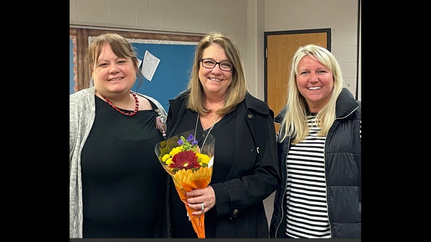Stephanie Clatterbaugh (middle) learns that she is Georgia's Gifted Program Teacher of the Year.